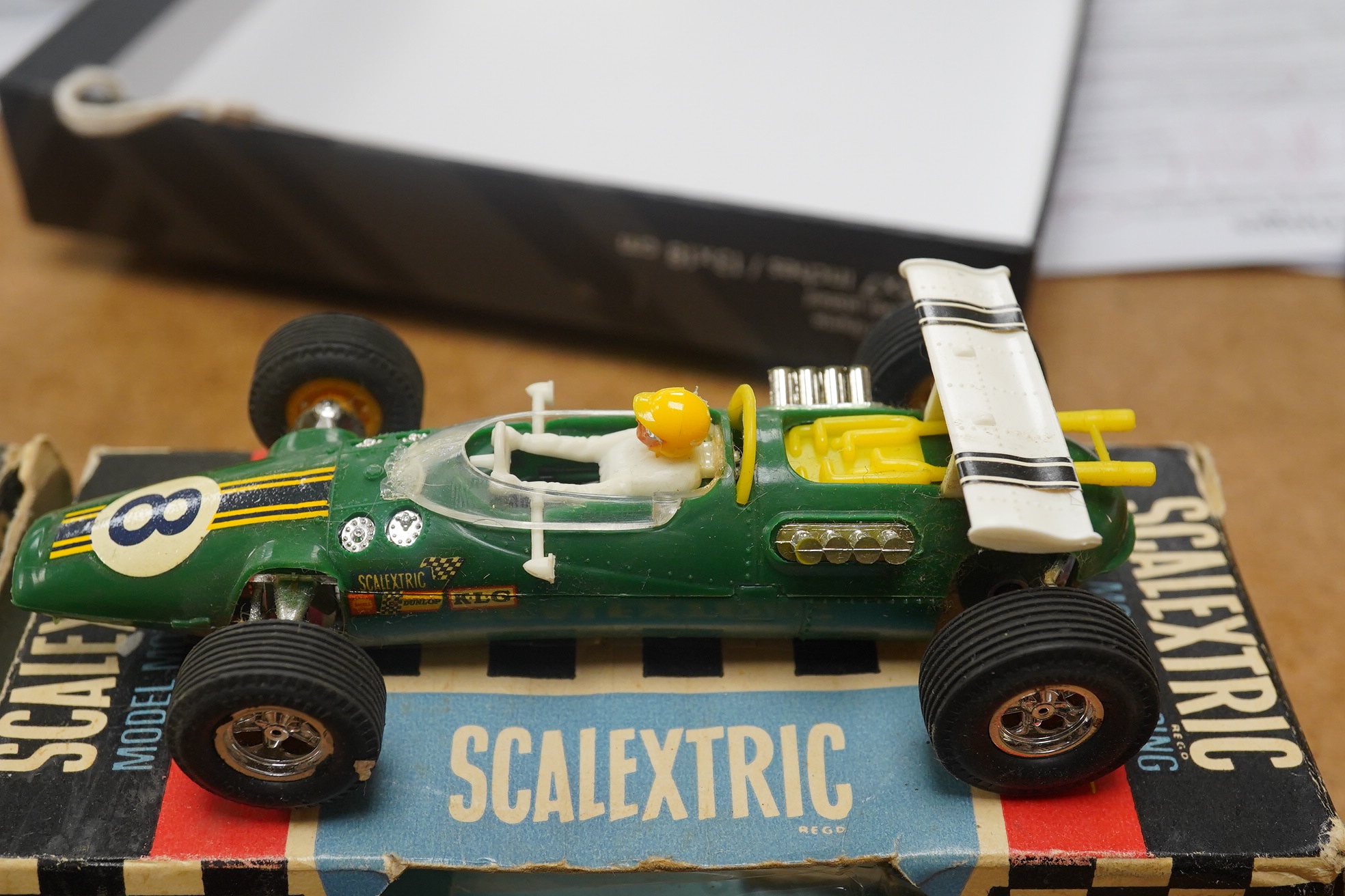 Two boxed 1960s Scalextric ‘race-tuned’ racing cars; a Lotus Indianapolis GP (C8) and a Scalextric Team Car (C19), both with inner card trays. Condition - poor, restoration needed to cars and boxes.